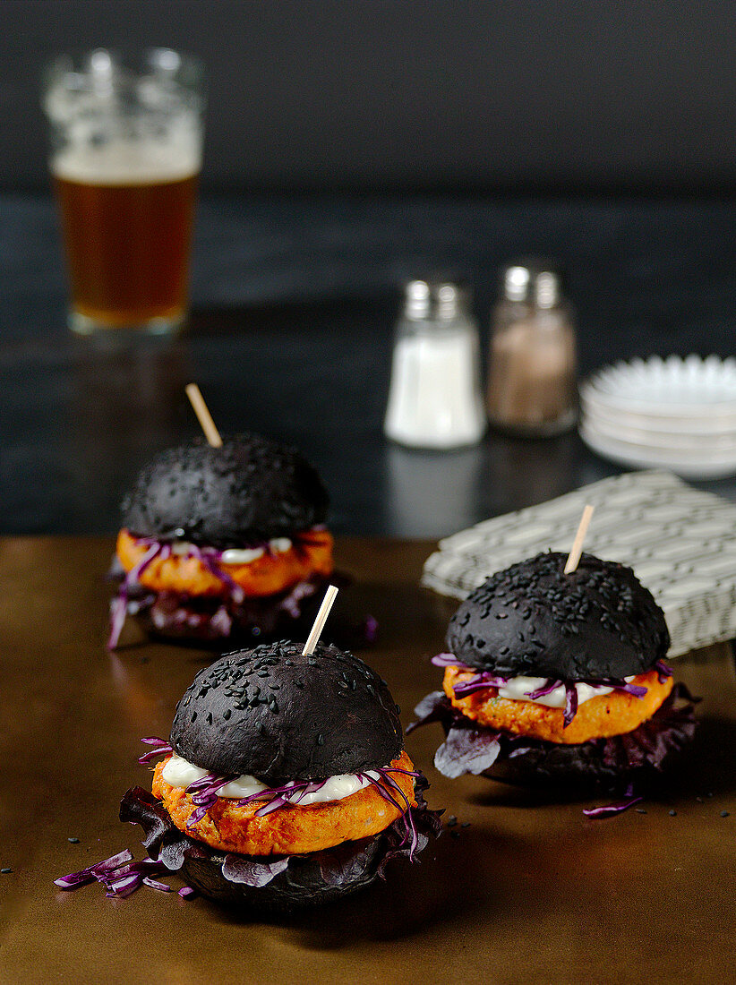 Mini black burgers with salmon patties