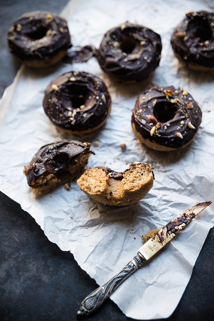 Vegan coffee and hazelnut doughnuts with chocolate glaze