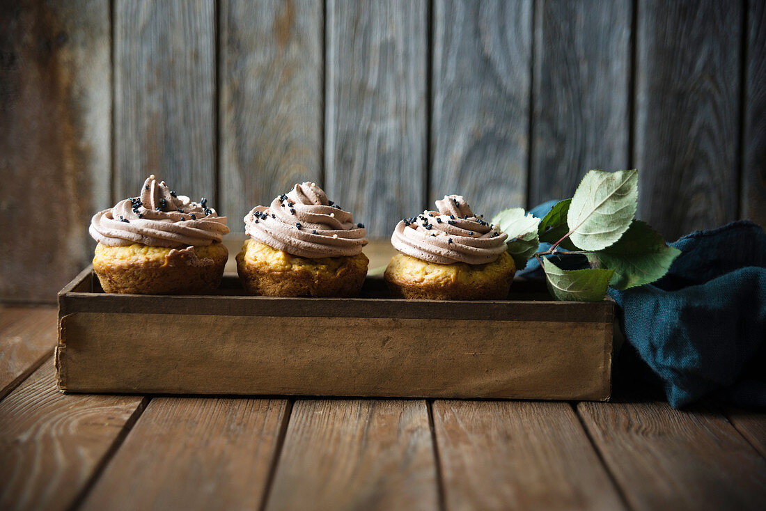 Vegan pumpkin cupcakes with chocolate cashew frosting and sugar decorations