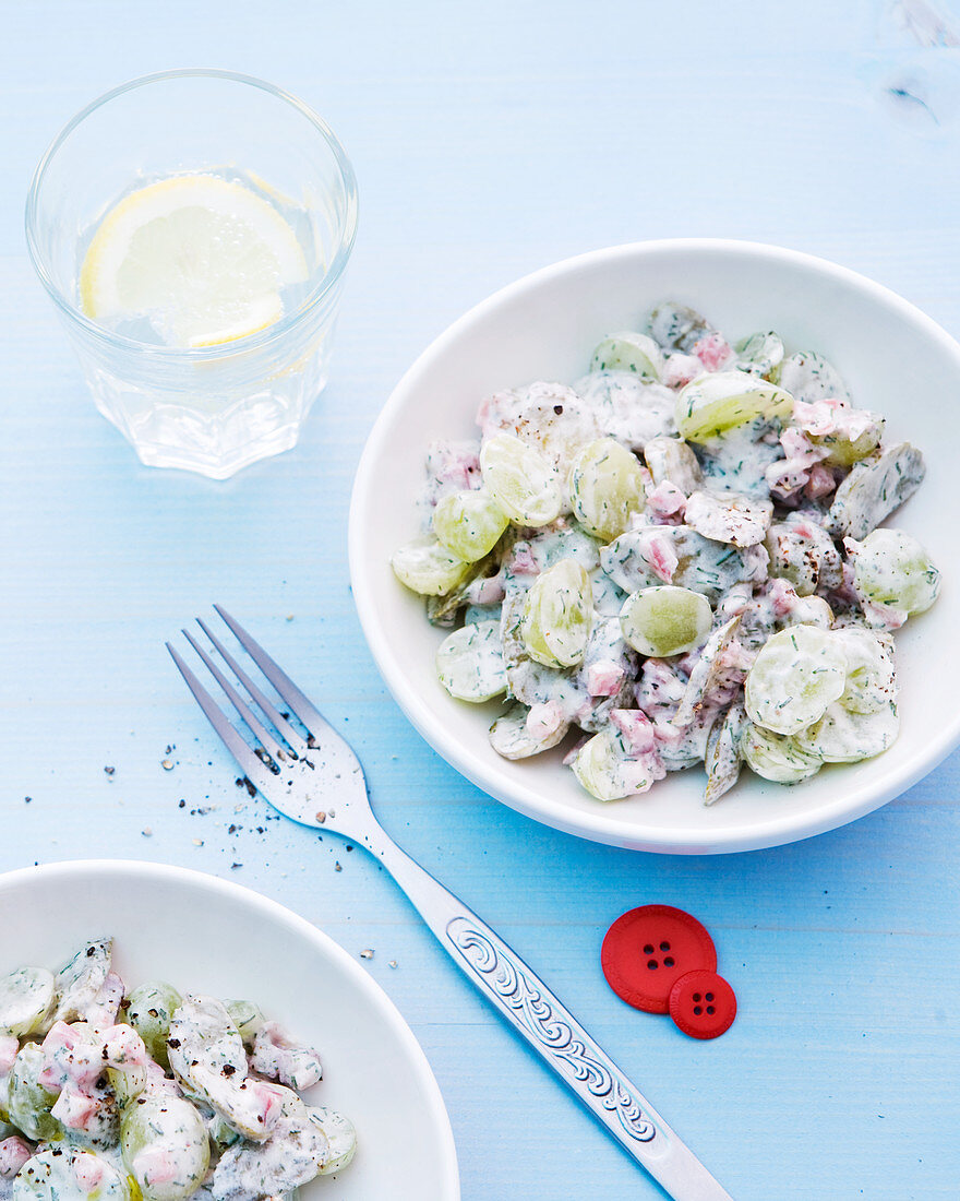 Cucumber salad with ham and grapes