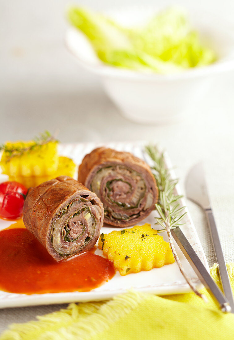 Italian beef roulade with polenta and tomato sauce