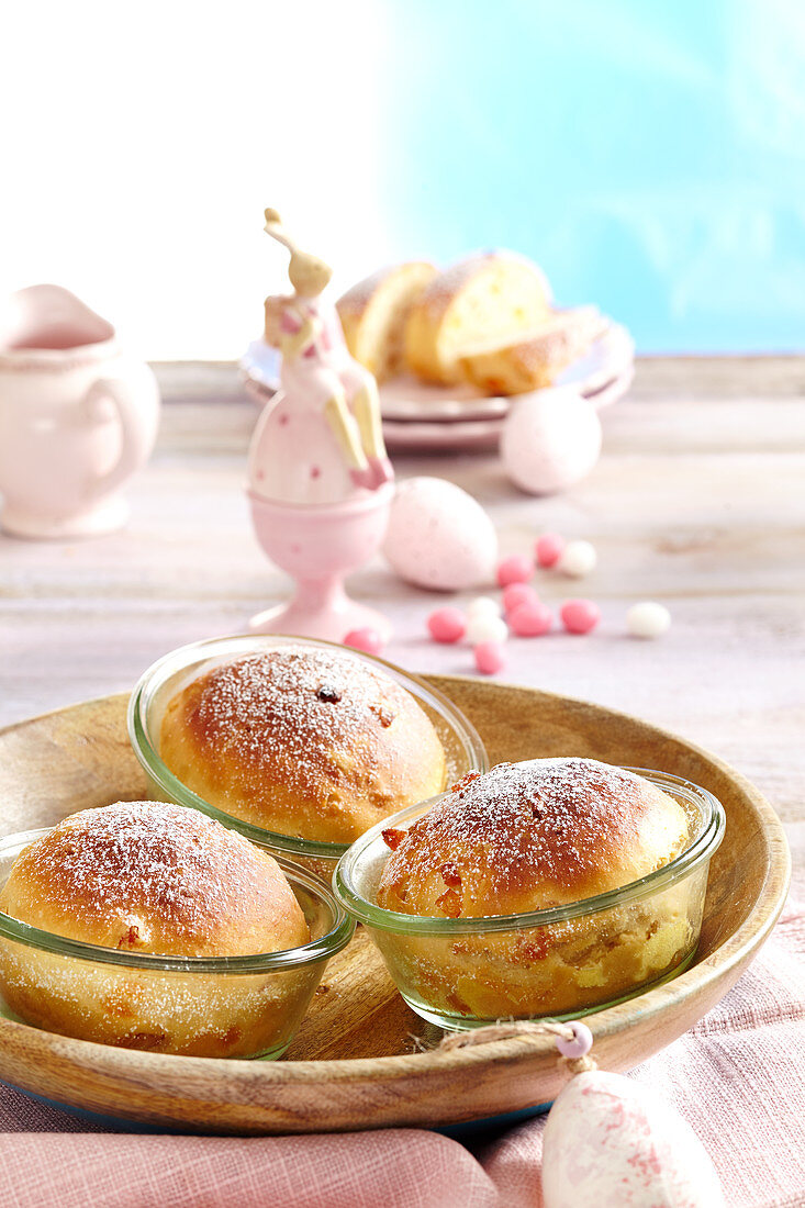 Mini Easter panettone in jars in a wooden bowl