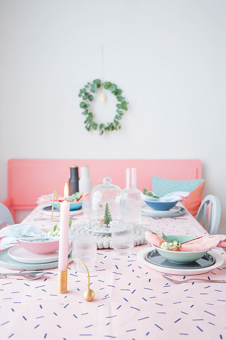 Table set in feminine pastel shades for Christmas dinner