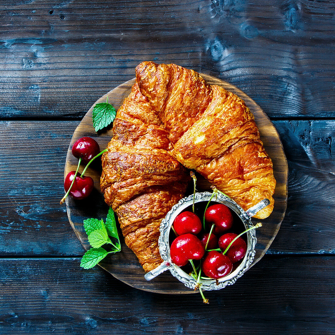 Breakfast croissants and fresh cherry