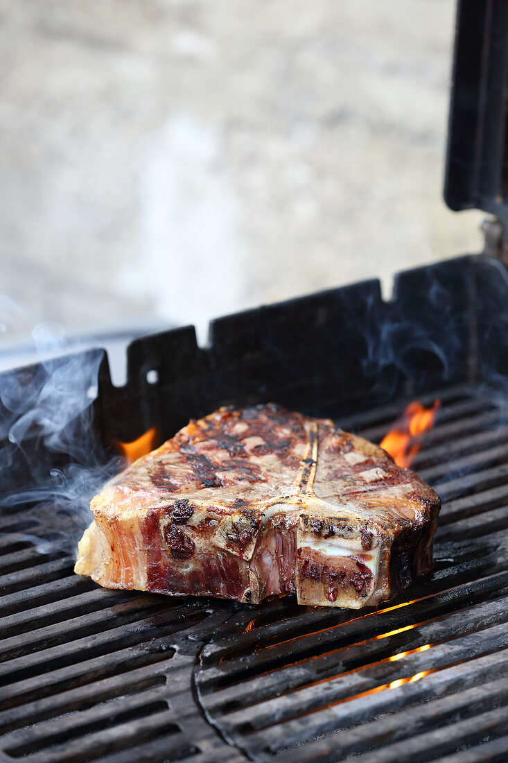 Porterhouse steak on a grill