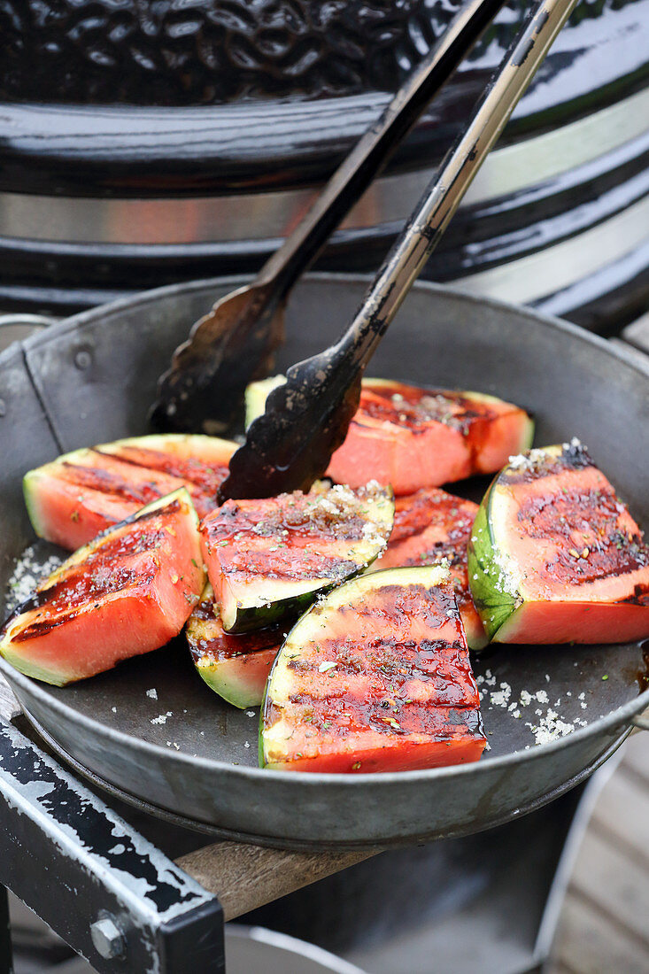 Grilled watermelon sprinkled with rosemary sugar