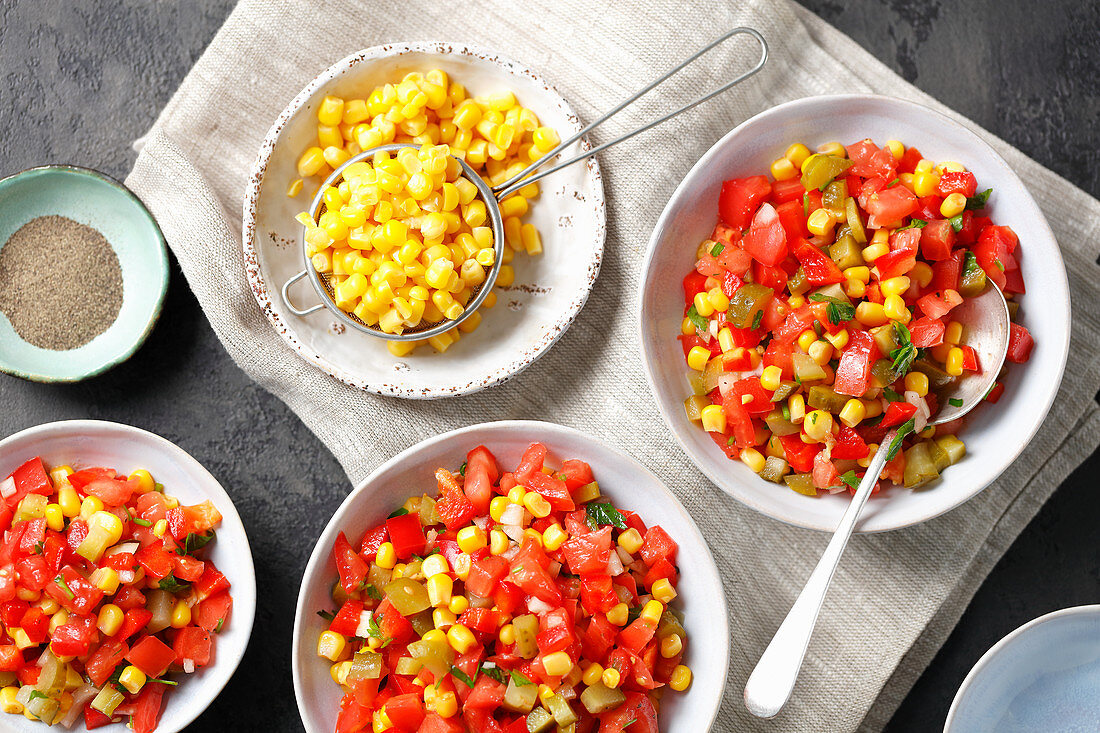 Tomato, sour cucumbers, corn and pepper salad