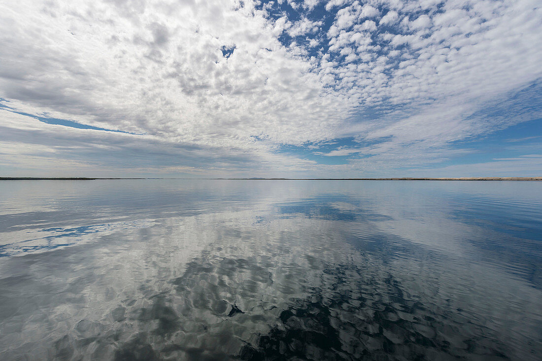 Clouds reflected in water