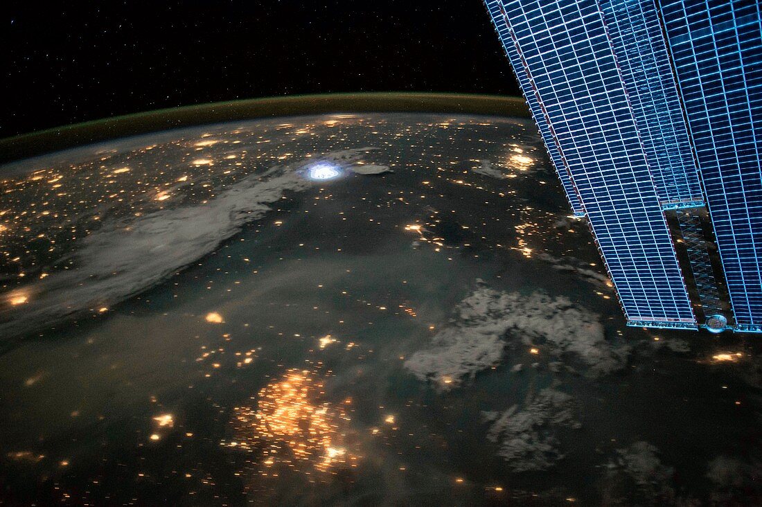 Lightning and city lights, ISS image