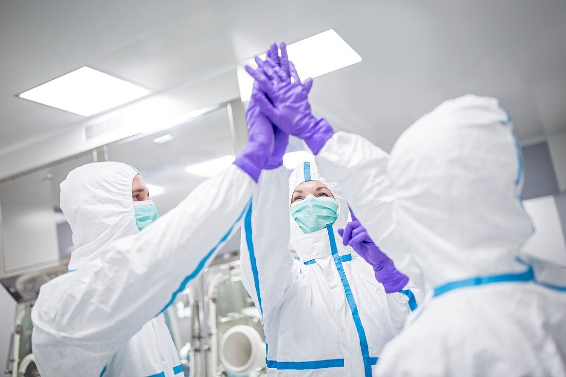 Lab technicians high-fiving