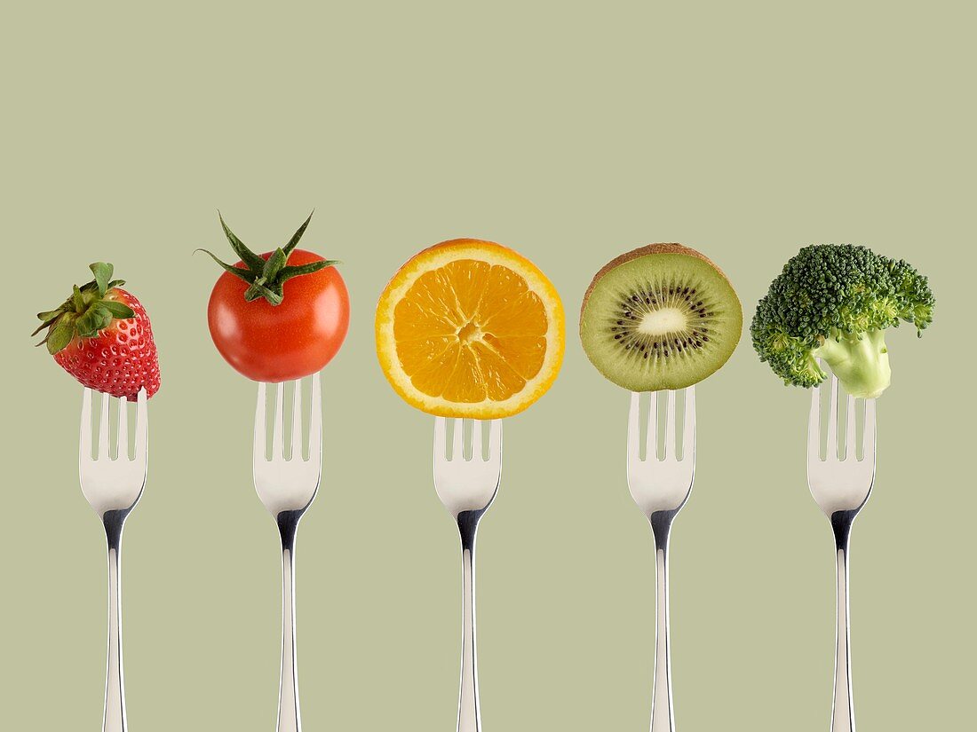 Fresh fruit and vegetables on forks