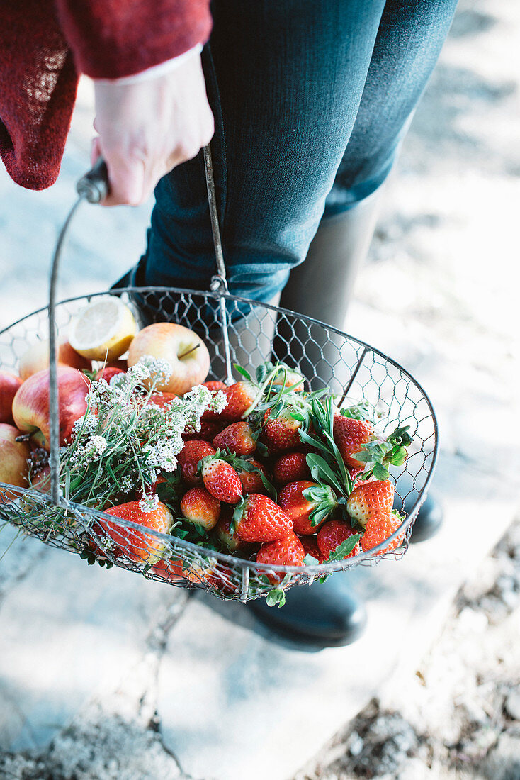 Woman carrying fruit basket