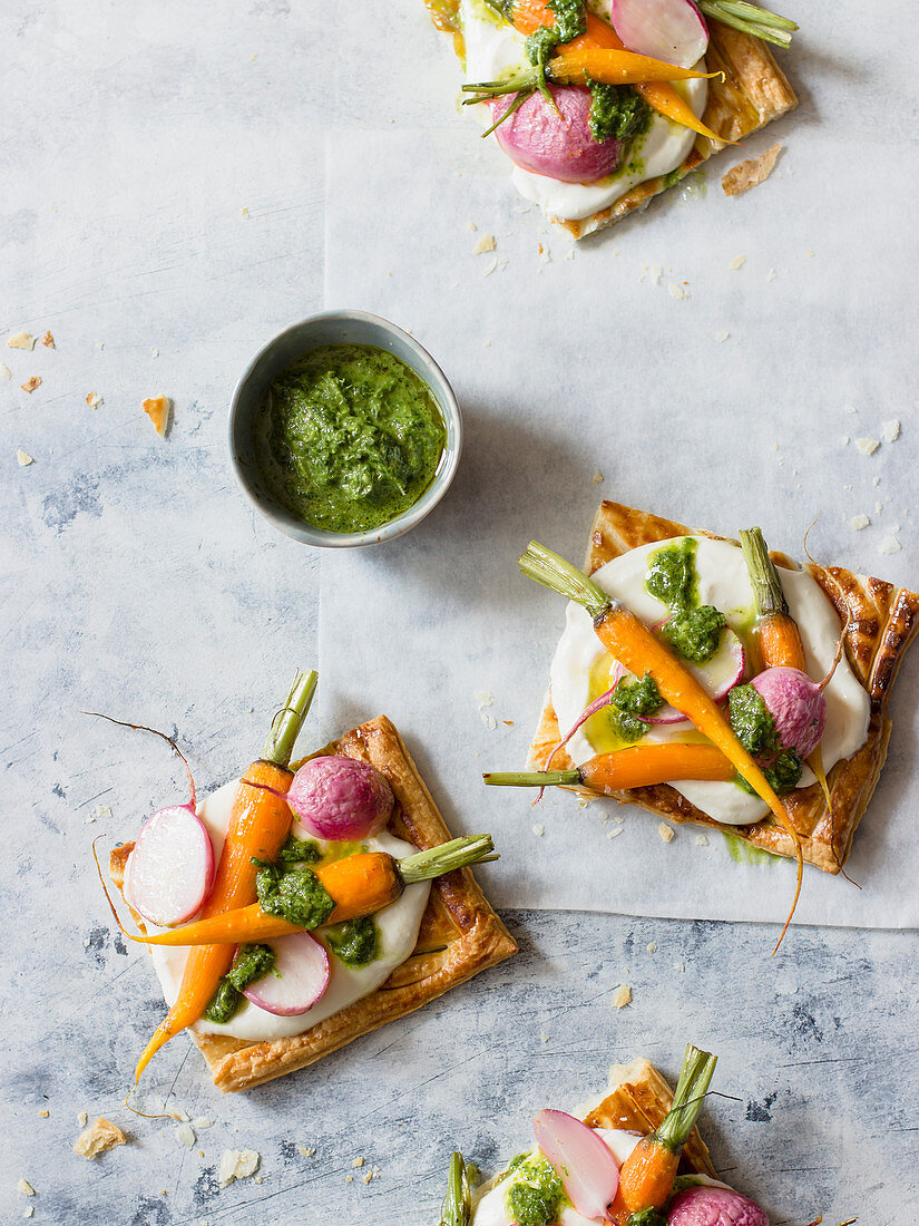 Puff pastry tart with lemon feta and cream cheese spread, roasted baby carrots, radishes and carrots