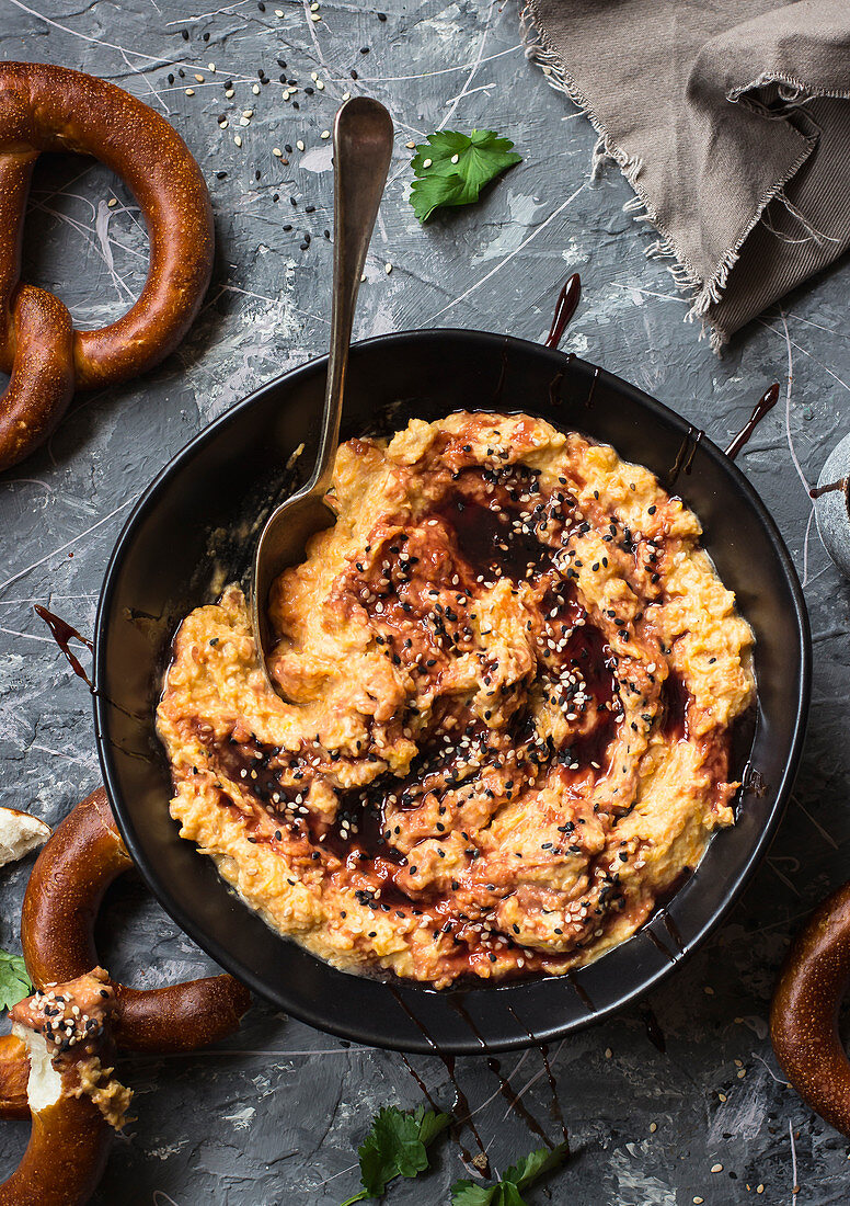 Roasted butternut squash, yogurt and tahini dip with date melasa and sesame seeds