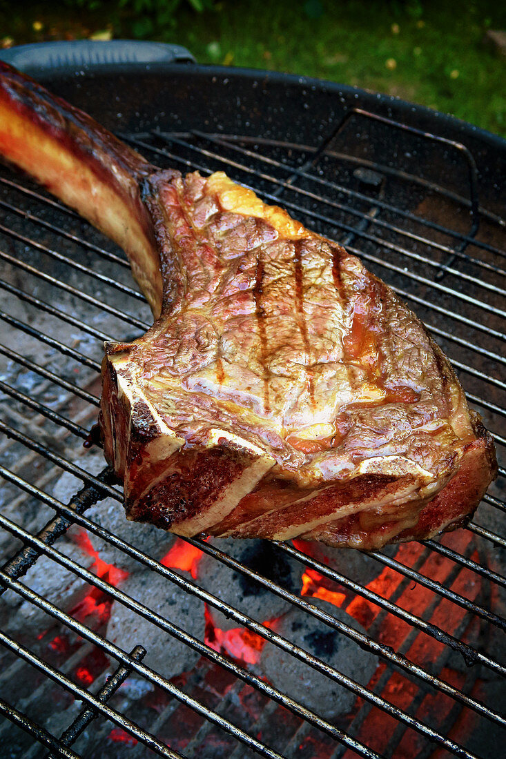 A grilled beef tomahawk steak