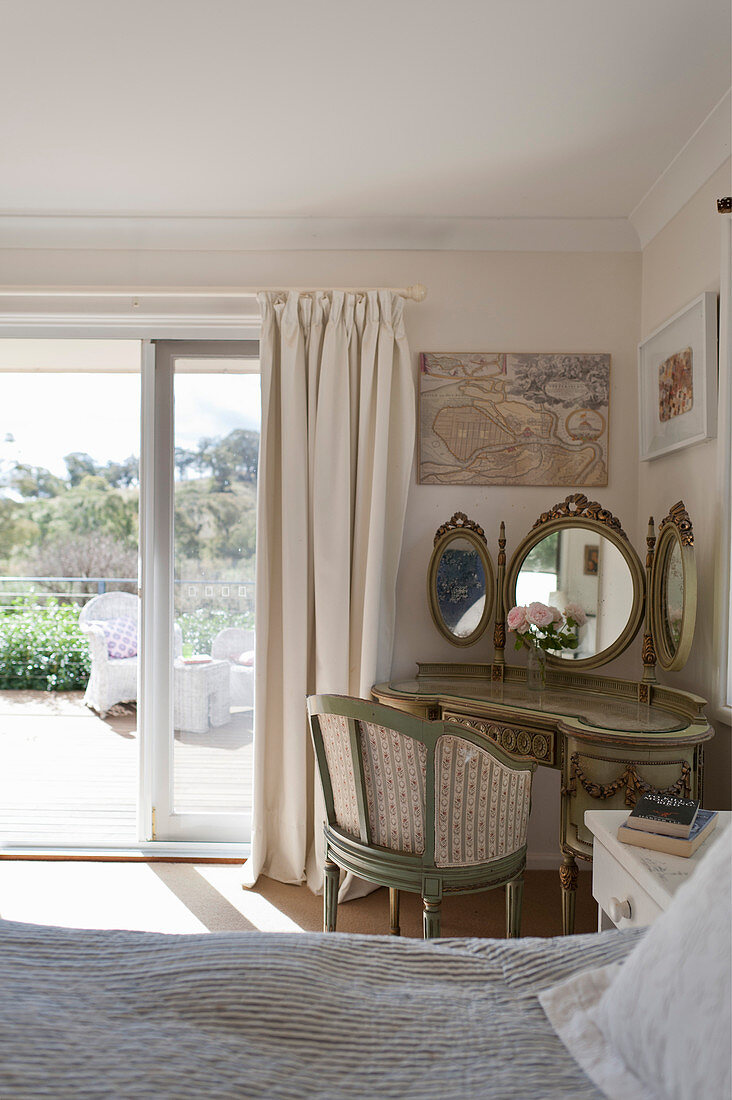 Baroque dressing table in bedroom with access to terrace