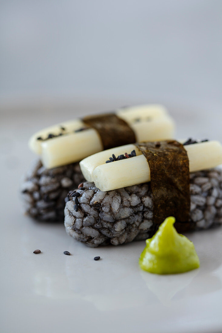 Vegan nirgiri sushi with black rice and sweet and sour pickled lotus roots