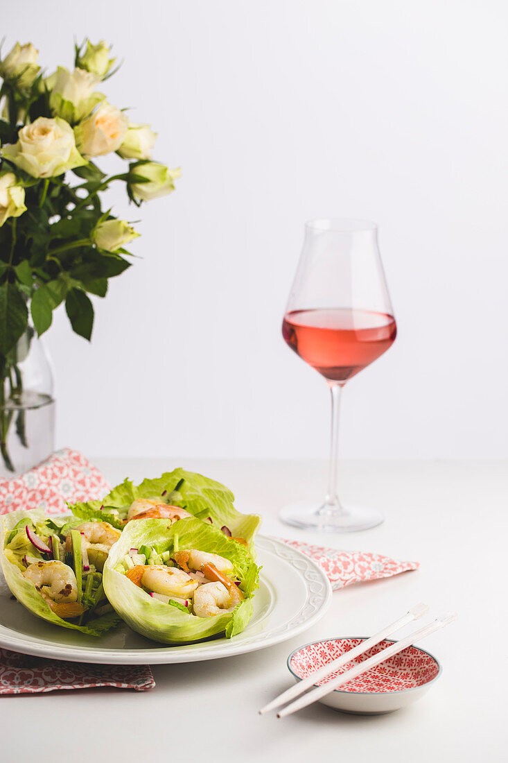 Prawns in lettuce leaves served with rosé wine