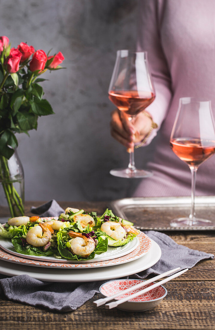 Prawns in lettuce leaves served with rosé wine