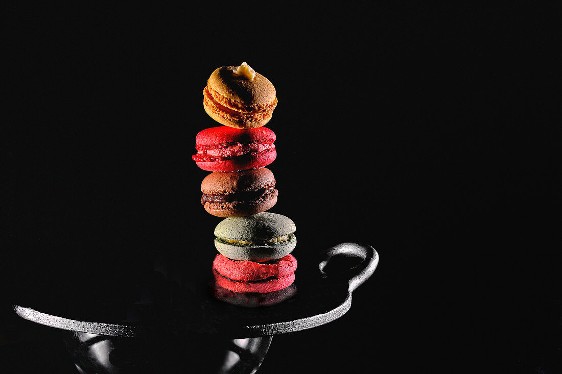 A stack of macaroons with fruit cream