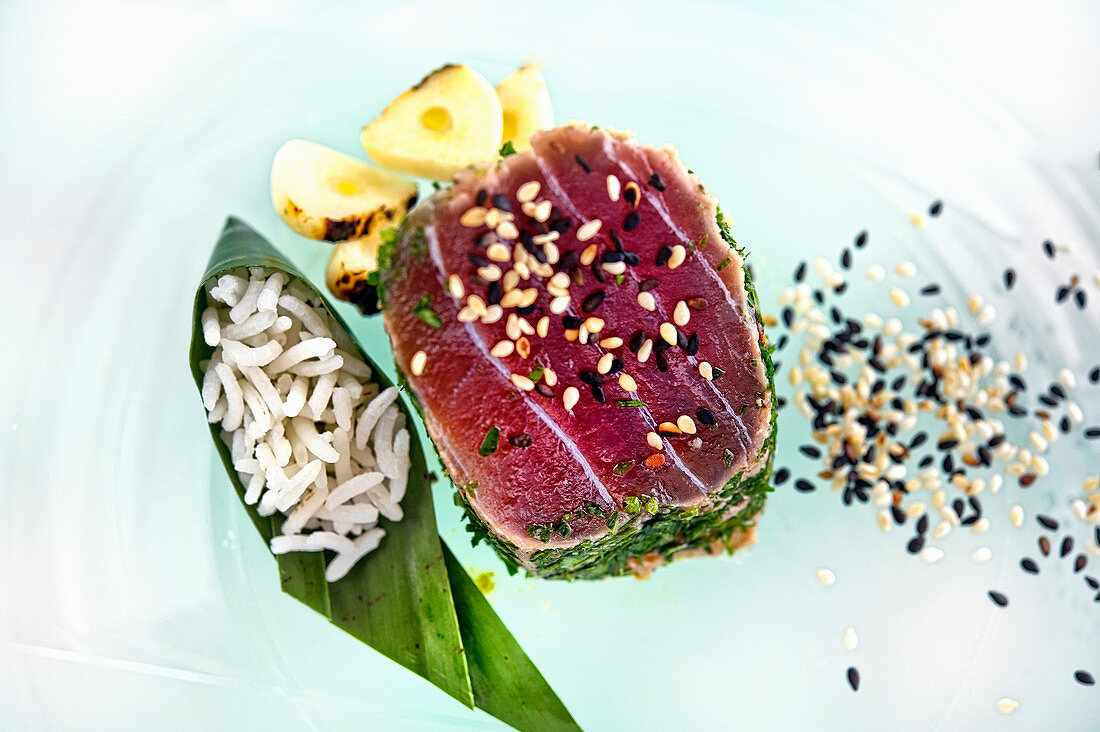 Tuna fish with a herb crust served with rice and sesame seeds (Vietnam)