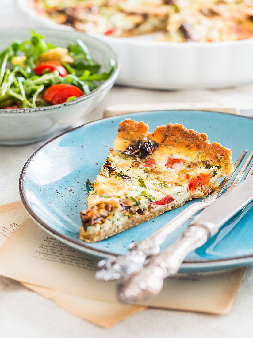 Slice of Gluten-Free Sundried Tomato and Arugula Quiche