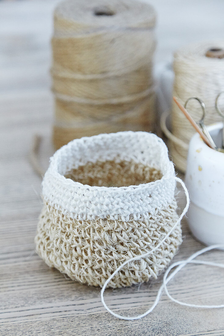 Storage basket crocheted from jute twine