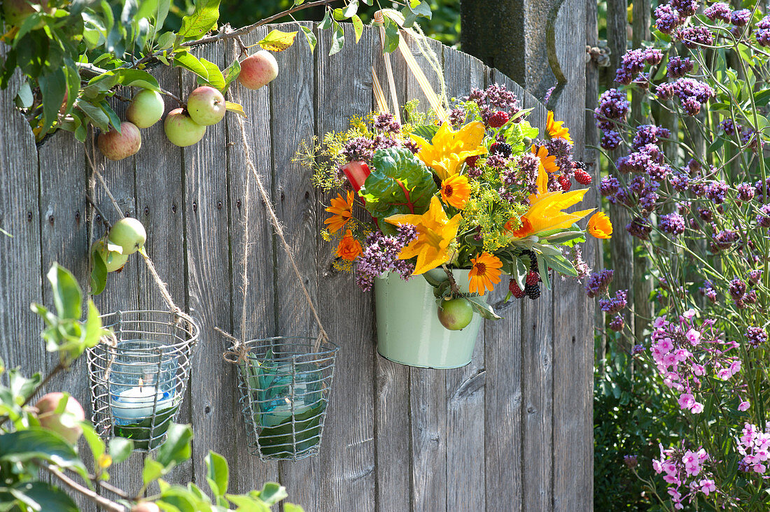 Colourful vegetables - herbs - bouquet at the garden gate