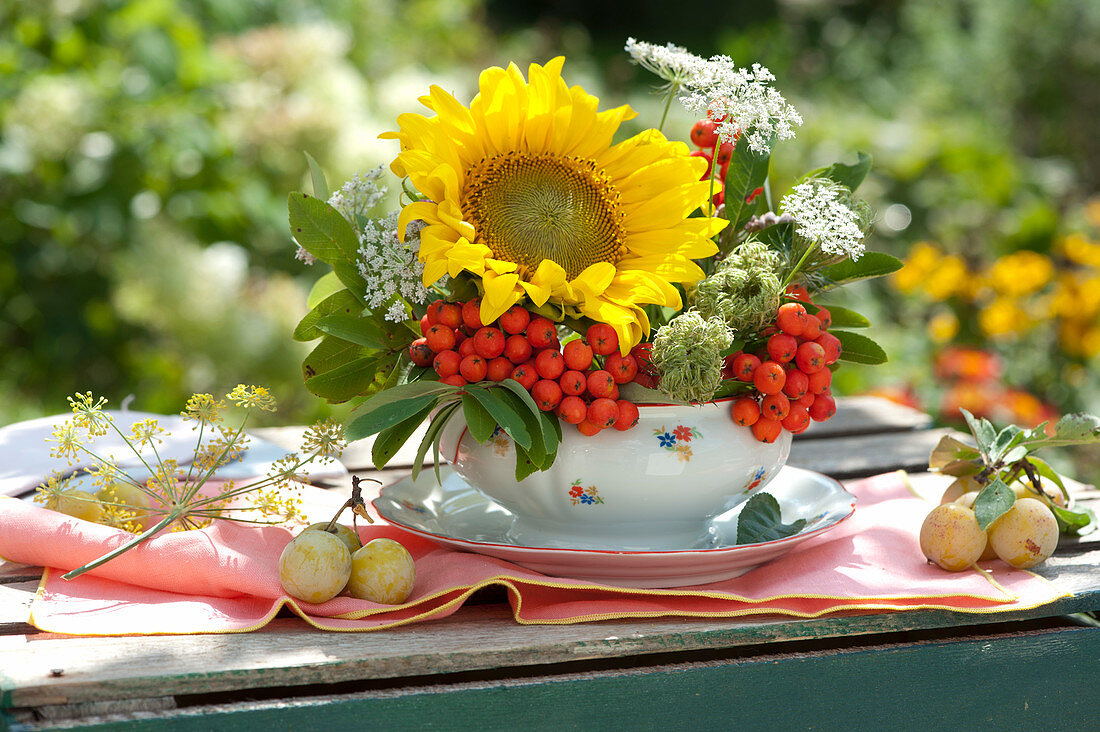 Small arrangement of sunflower, cumin and rowan berries