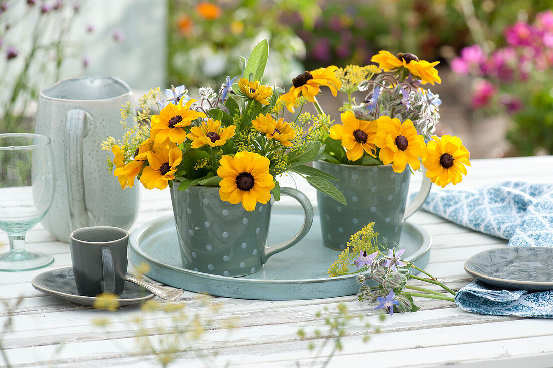 Small bouquets of coneflower, fennel flowers and borage