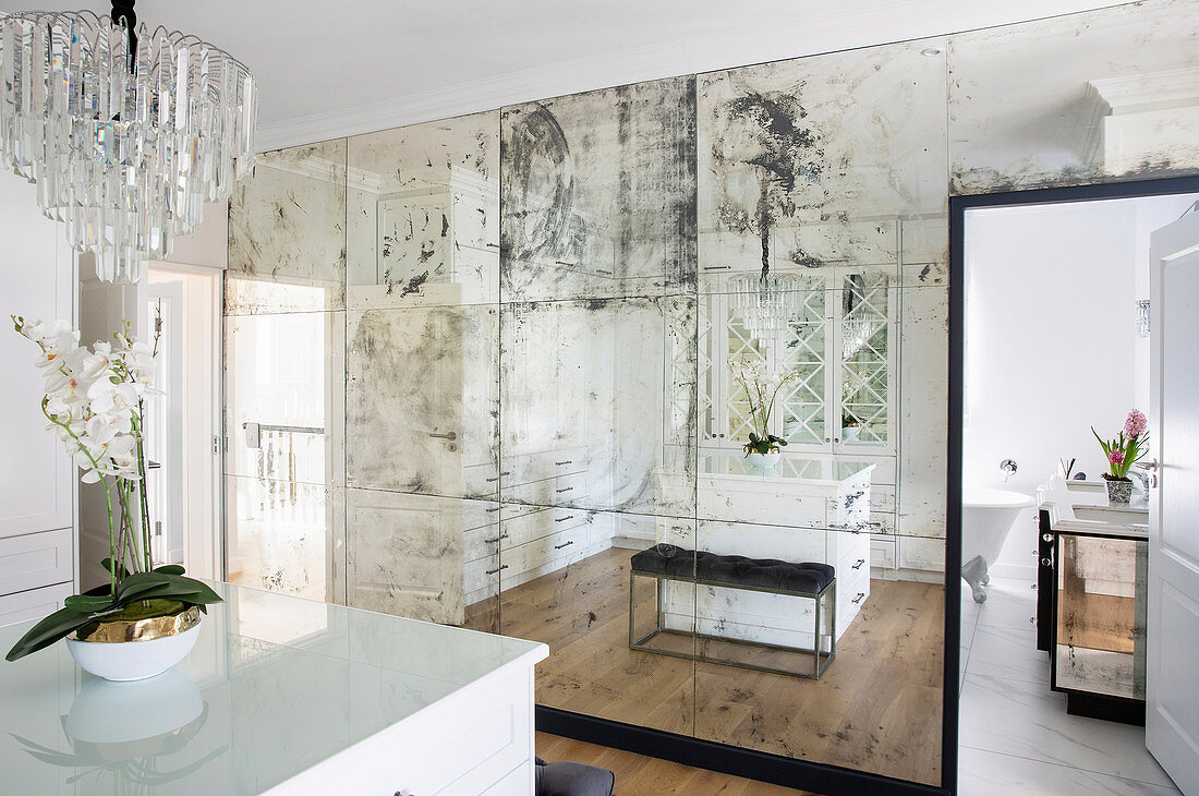 Patinated mirrored wall in dressing room