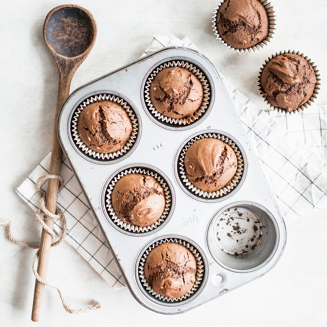 Chocolate muffins in a baking tin
