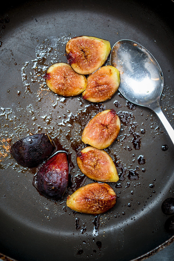 Fried figs in a pan (top view)