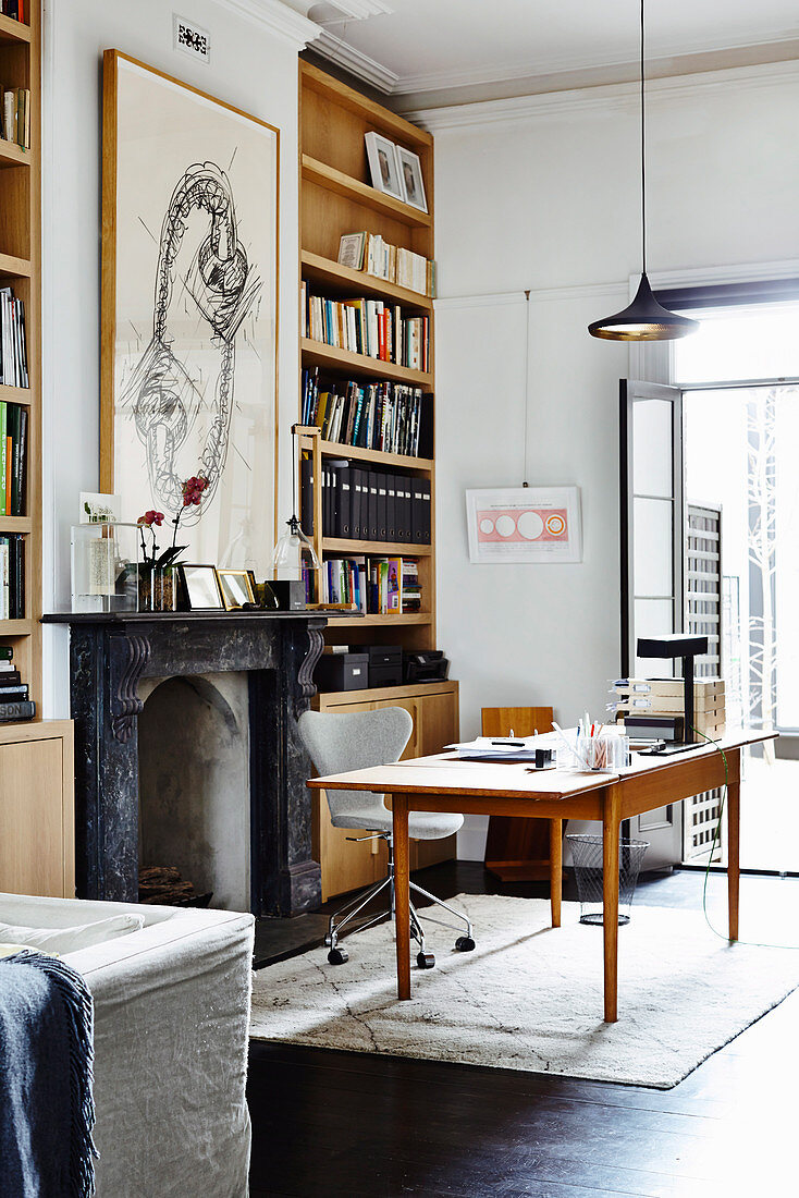 Bookshelves in the niches next to the fireplace in the study