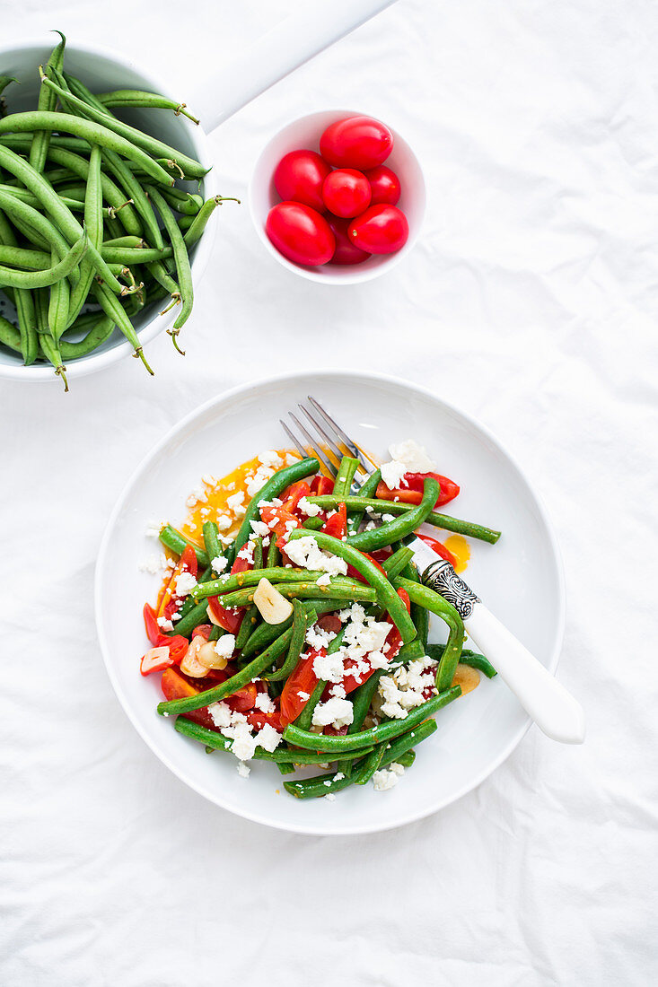 A salad with green beans, tomatoes, garlic and feta cheese (Greece)