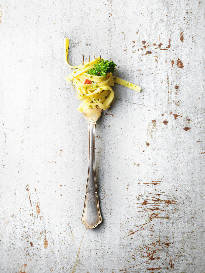 Tagliatelle with tender stem broccoli on fork