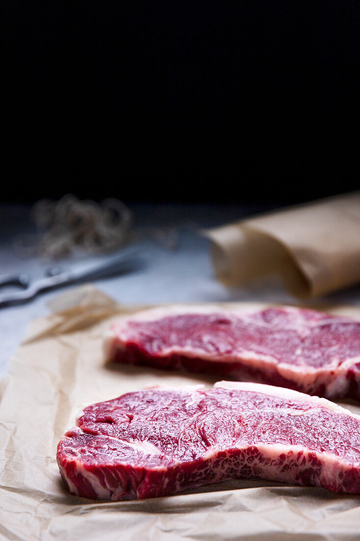 Raw New York strip steaks