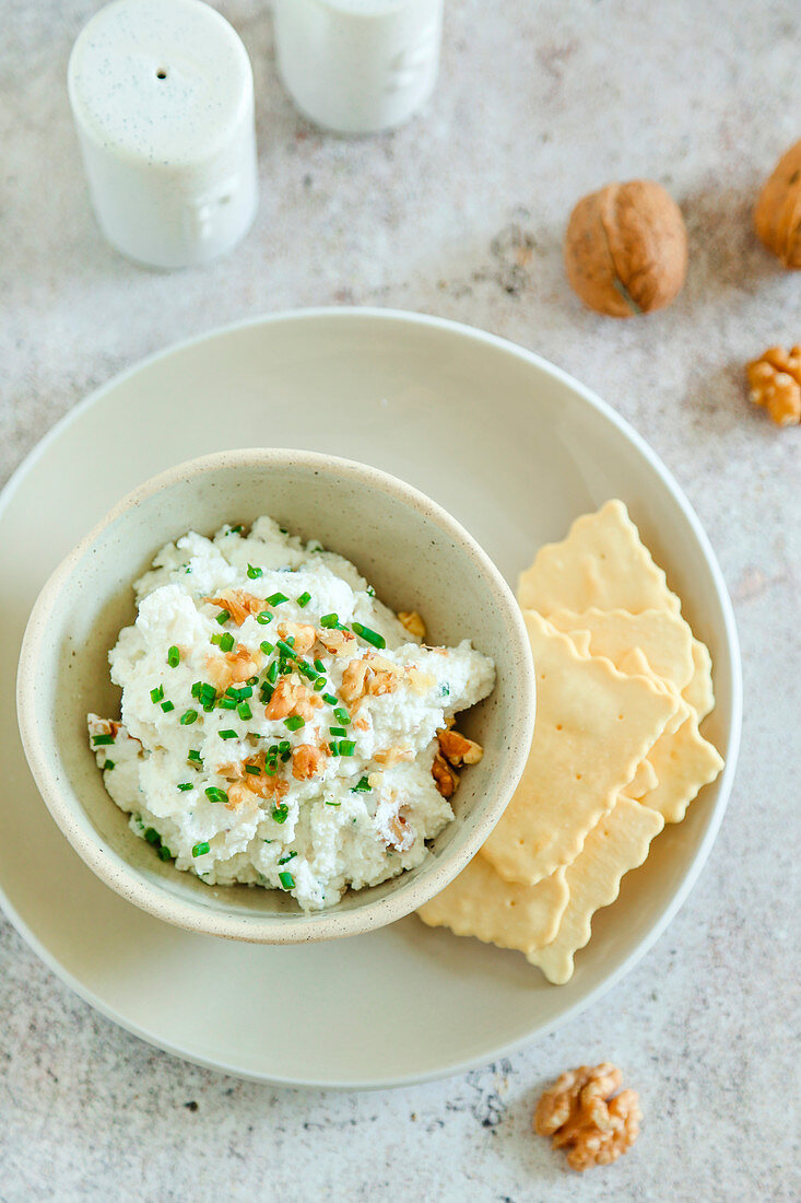 Ricotta cheese cream with chives walnuts and extra virgin olive oil for an aperitif