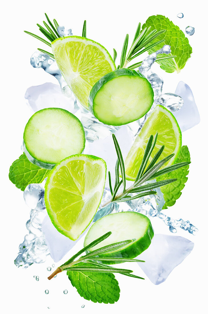 Lime, cucumber, rosemary and mint flying with ices and water splash