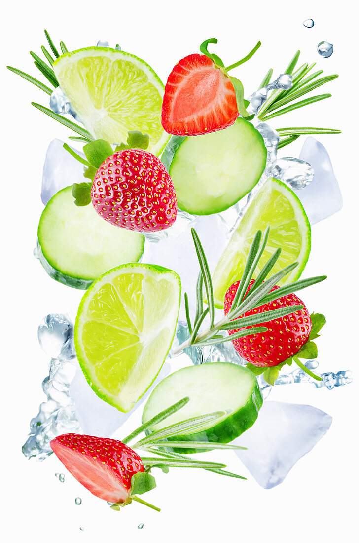 Lime, cucumber, strawberry and rosemary flying with ices and water splash