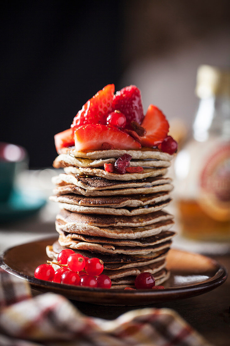 Stacked pancakes with strawberries