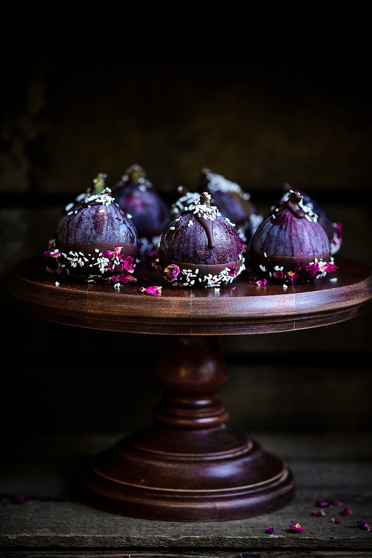 Gorgeous purple figs dipped in dark chocolate sprinkled with coconut and rose petals