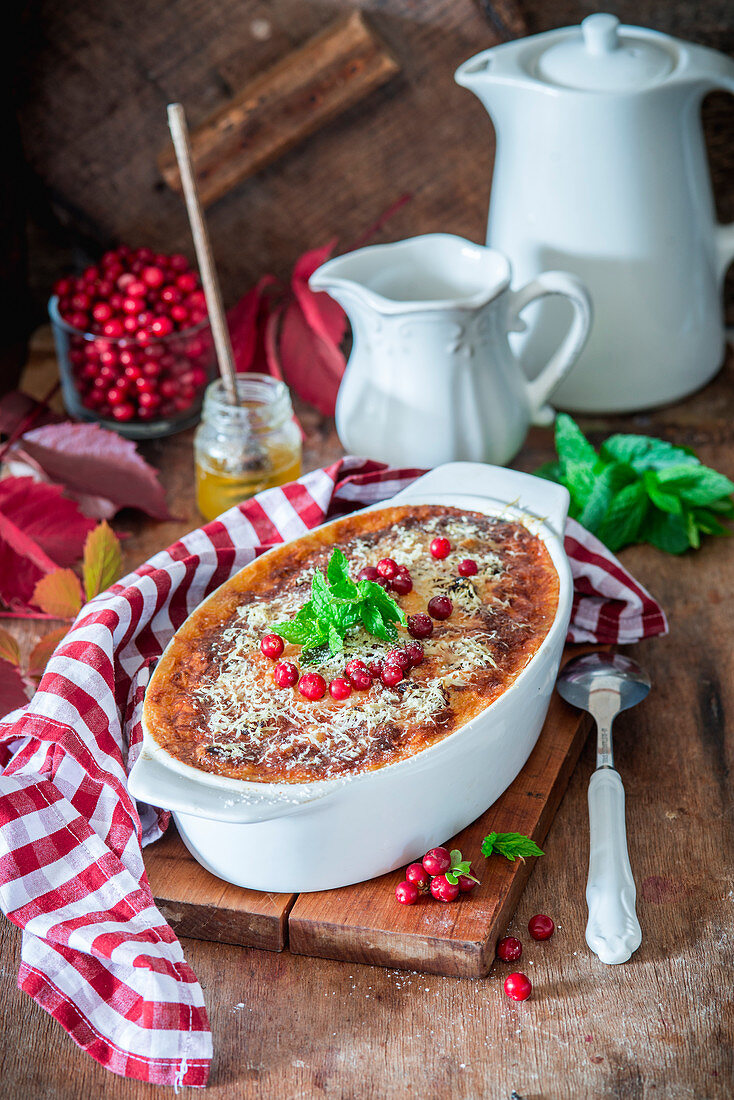 Baked rice pudding with cranberry and parmesan crust