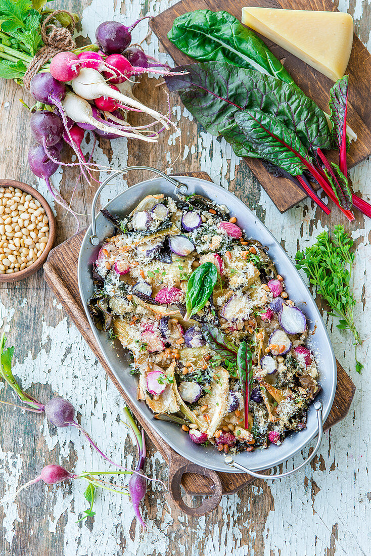 Radish, fennel and swiss chard gratin baked with grated parmesan and crumbs