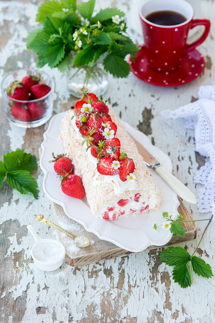 Meringue roll with strawberries and coconut