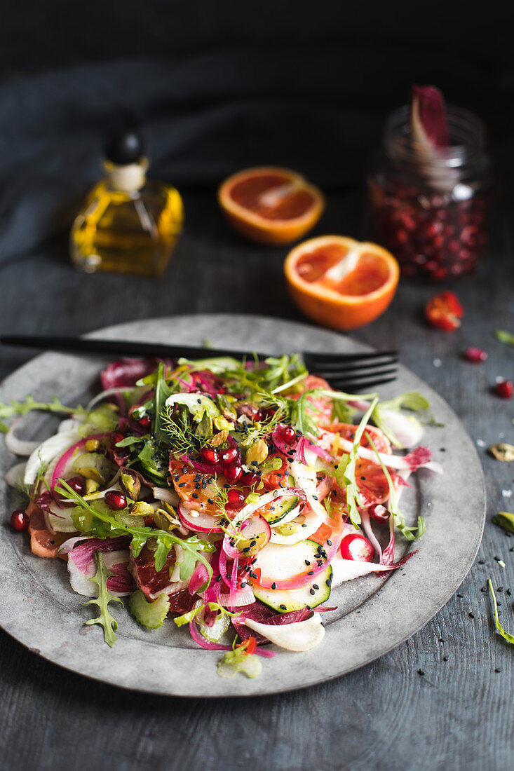 Vegetable salad with blood oranges and pomegranate seeds