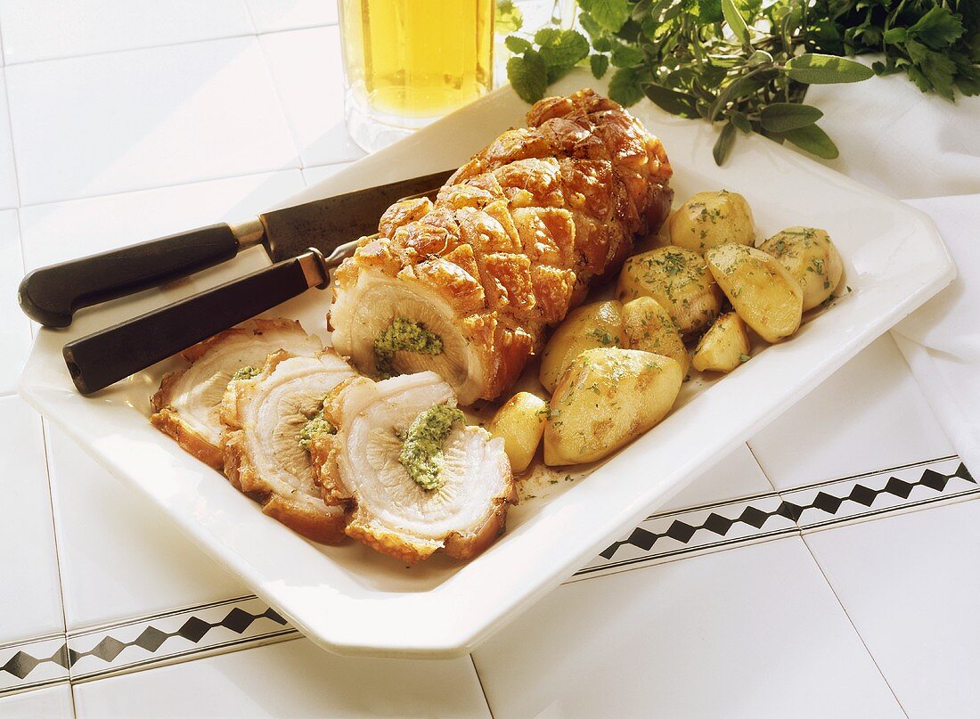 Herb-filled Rolled Roast with fried Potatoes