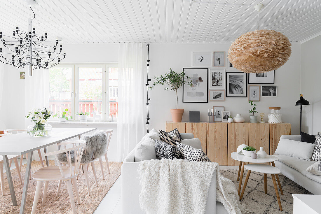 Scandinavian-style living-dining room in natural shades