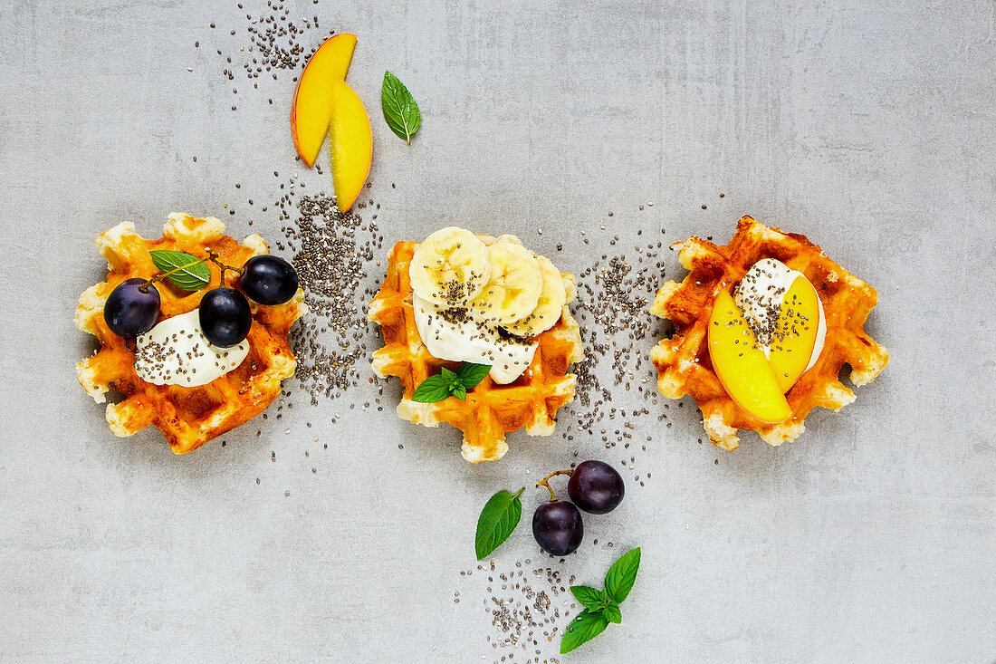 Fresh Traditional Belgian waffles, various fruits and whipped cream