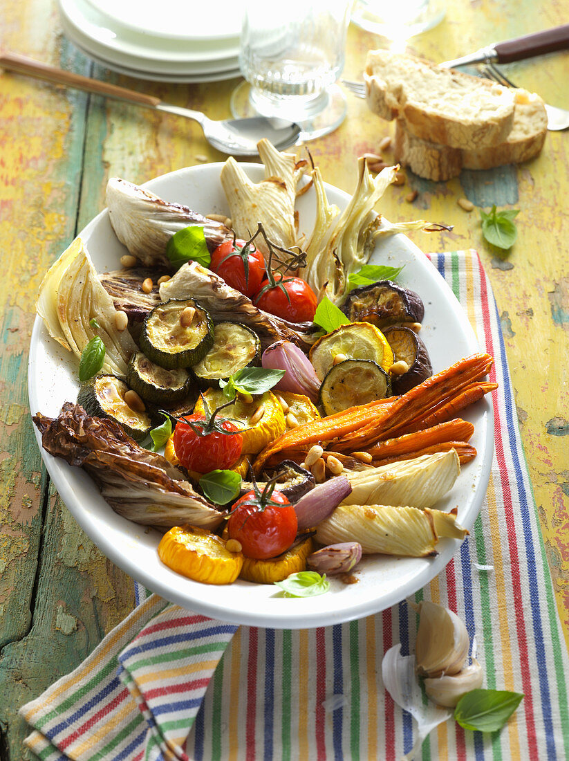 Grilled vegetables with pine nuts and bread